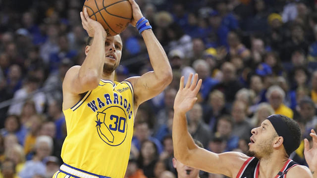 Warriors' Steph Curry holds up James Harden's No. 13 after getting called for travel on step-back move